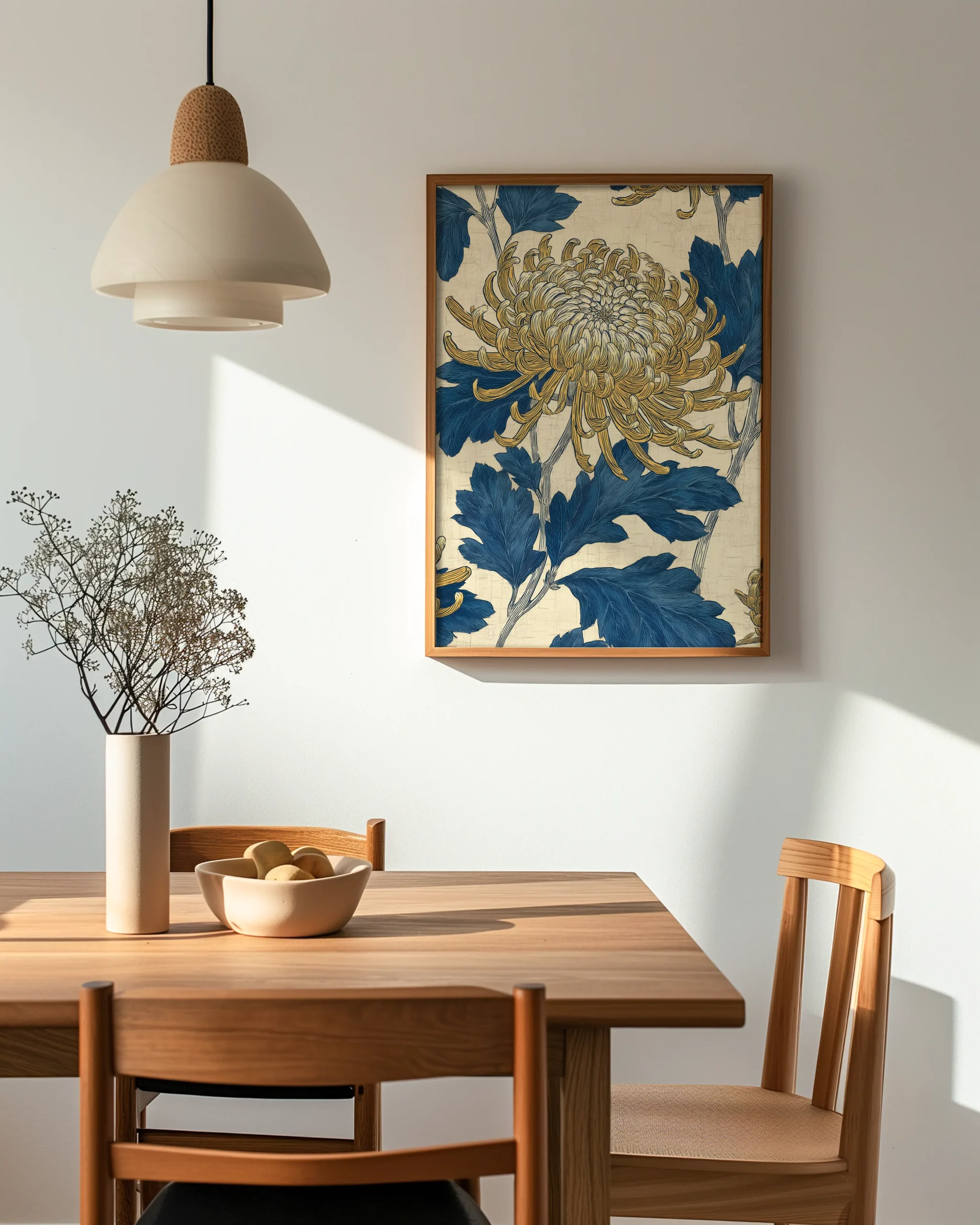 Chrysanthemum botanical wall art framed poster displayed in a Japandi style dining room with natural wood furniture