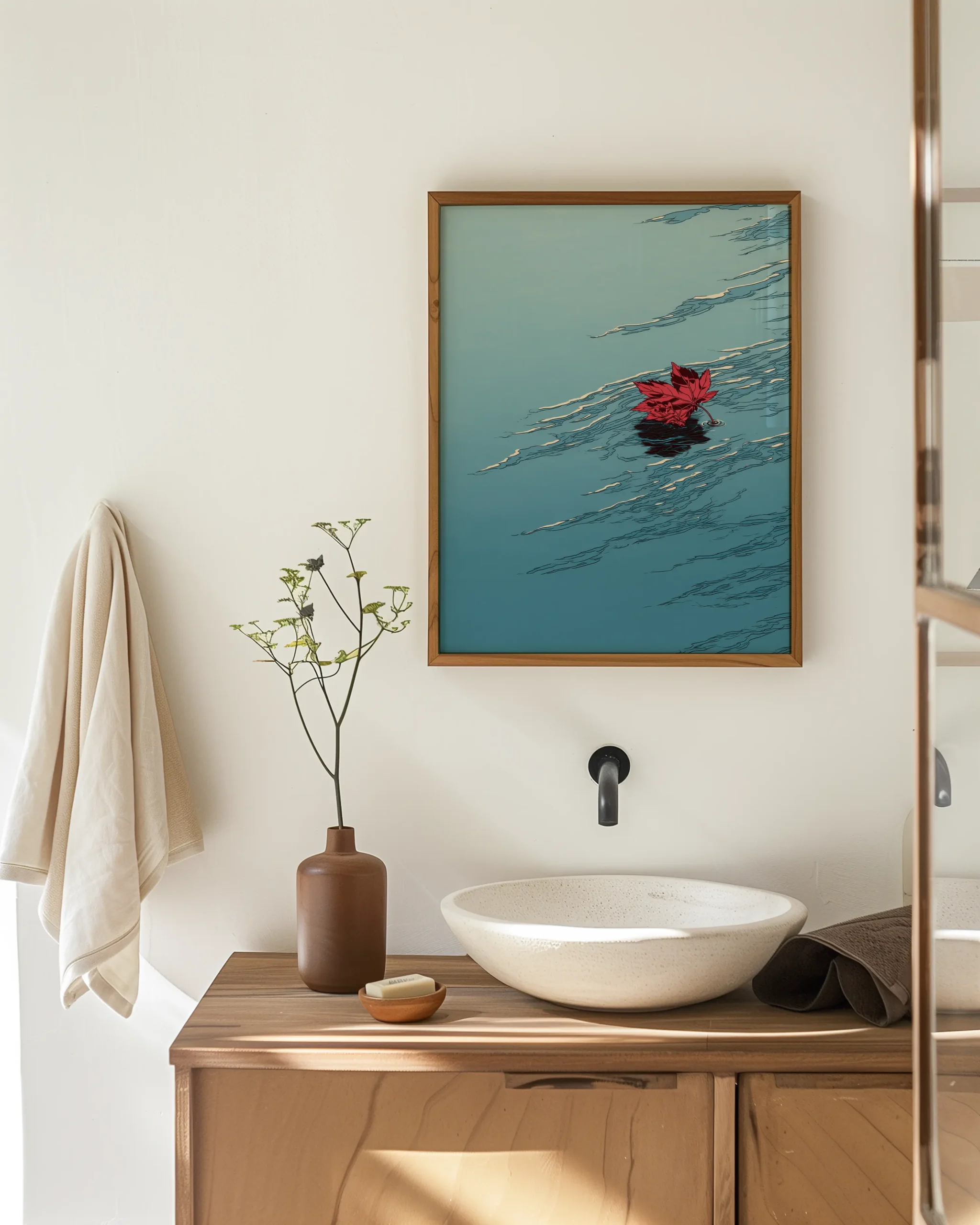 Japandi bathroom mockup with Floating Maple leaf II framed poster above a sink, featuring a red maple leaf on teal water
