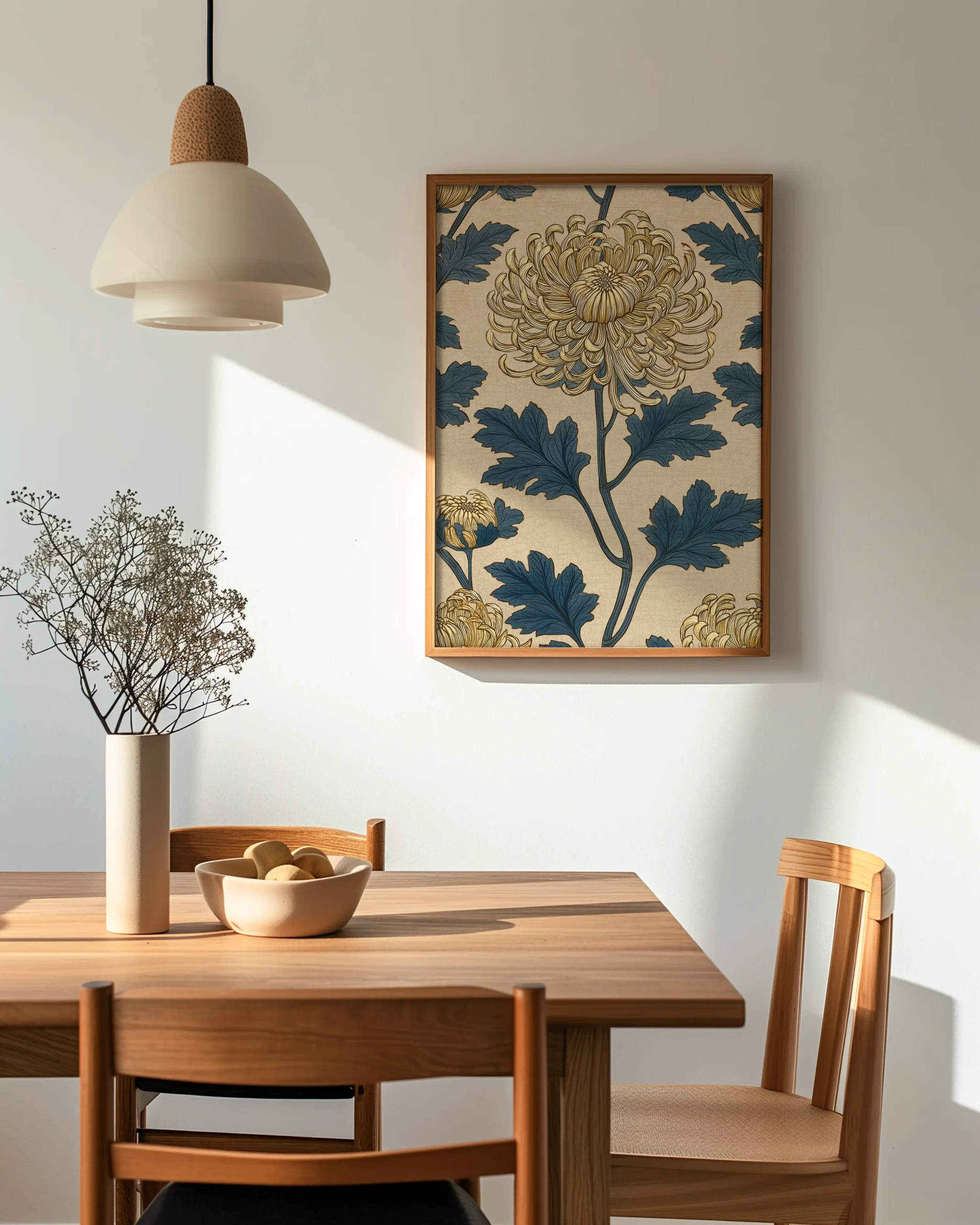 Angled view of Golden Chrysanthemum framed poster with gold flower and blue leaves in a bright dining room setting