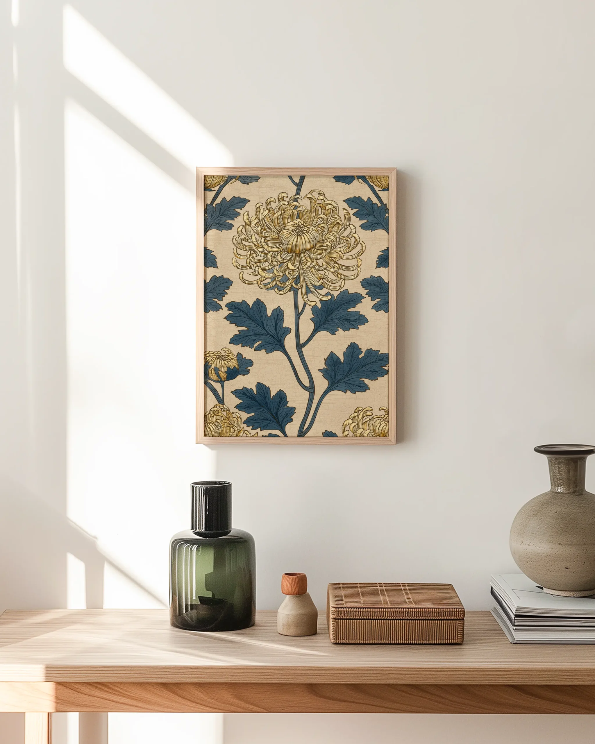 Blue and gold chrysanthemum botanical framed poster hanging above a wooden console table in a minimalist hallway