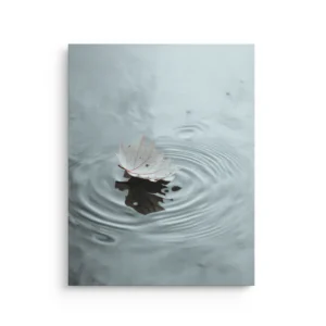 Japanese maple leaf floating on water ripples in soft gray blue tones thin canvas wall art