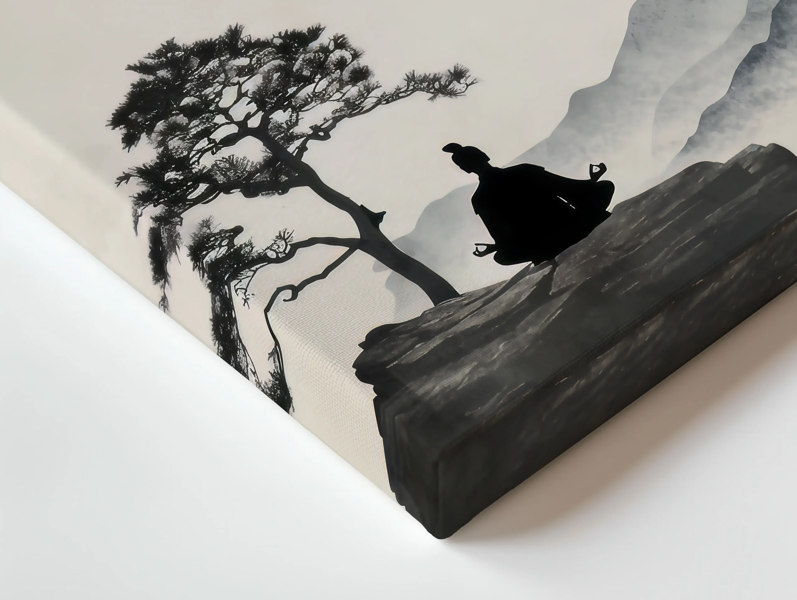 Close-up of thin canvas edge showing textured surface with black ink pine tree and rocky cliff details on a neutral background.