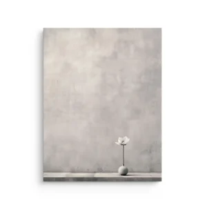 Minimal white lotus in a small vase on a ledge against a soft grey wall, thin canvas wall art for Japandi and Zen decor.