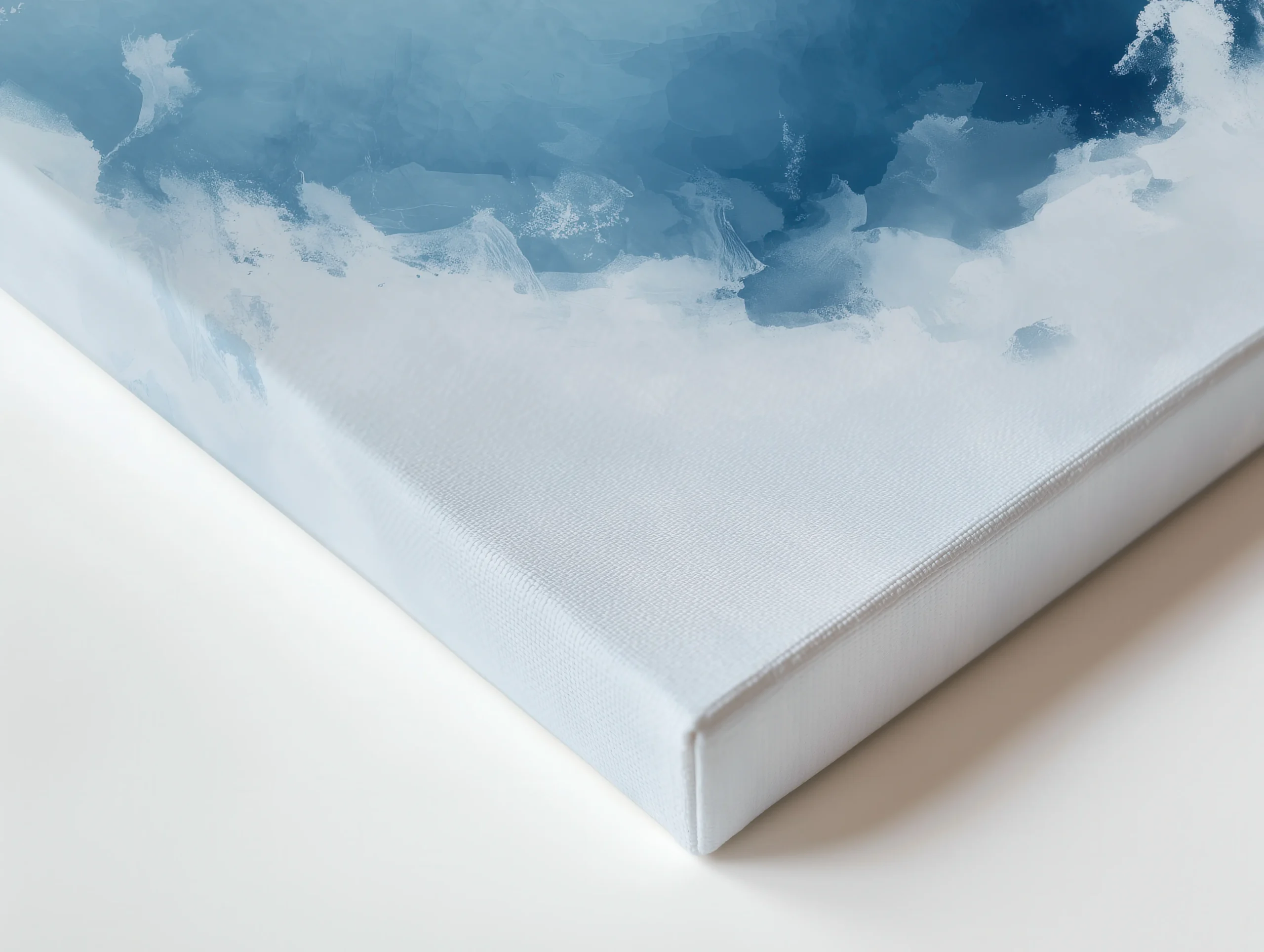 Close-up of premium thin canvas edge showing soft blue watercolor washes and misty gradients from a minimalist humpback whale ocean heart artwork.