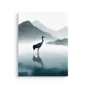 Minimal ink wash crane standing in still water with a soft reflection and misty blue-gray mountains on premium thin canvas wall art.