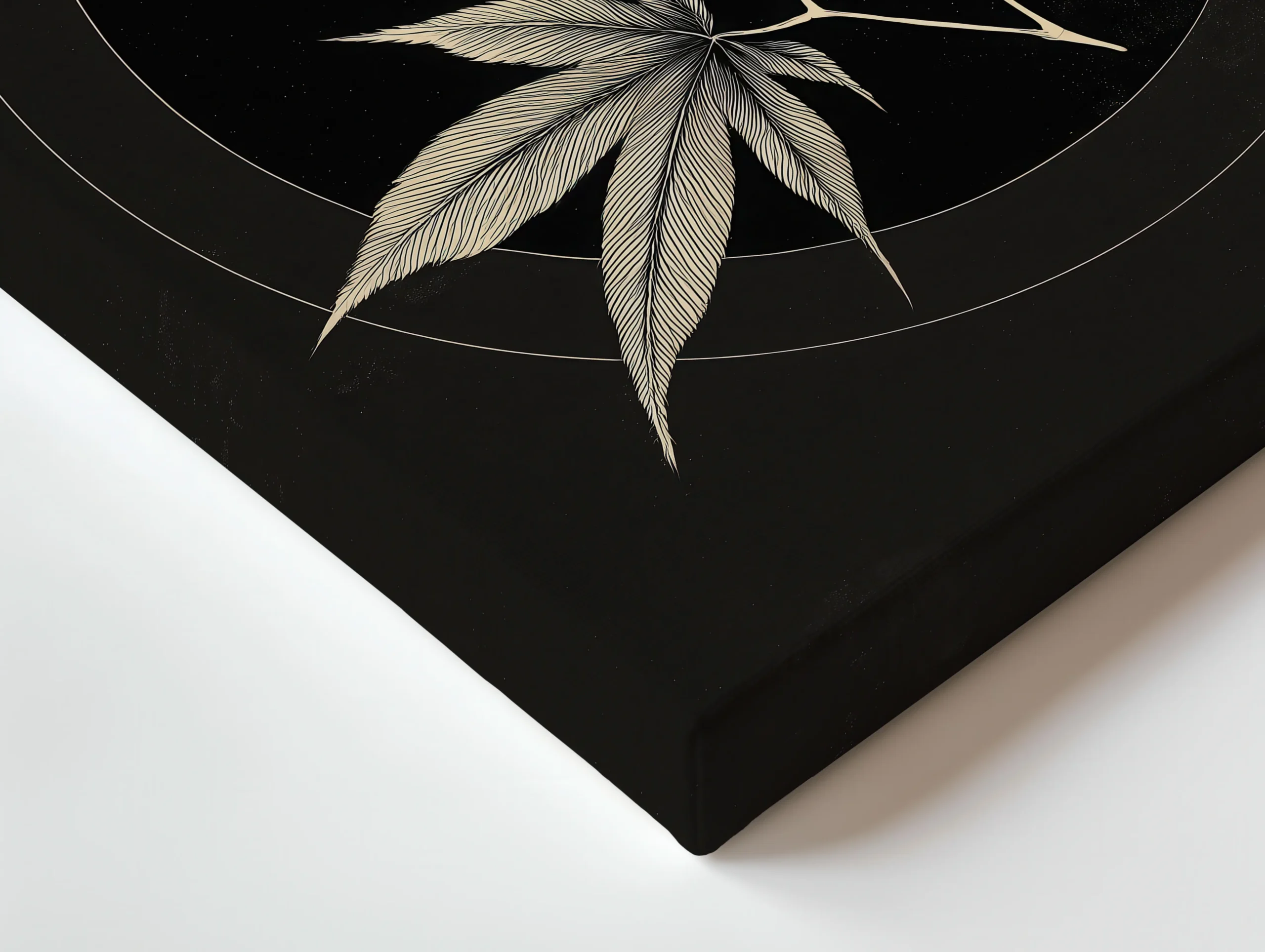 Close up of thin canvas texture and wrapped edge showing Crescent Maple Balance maple leaves on black